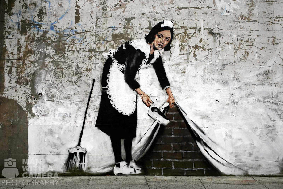 banksy-maid-sweeping-under-the-carpet